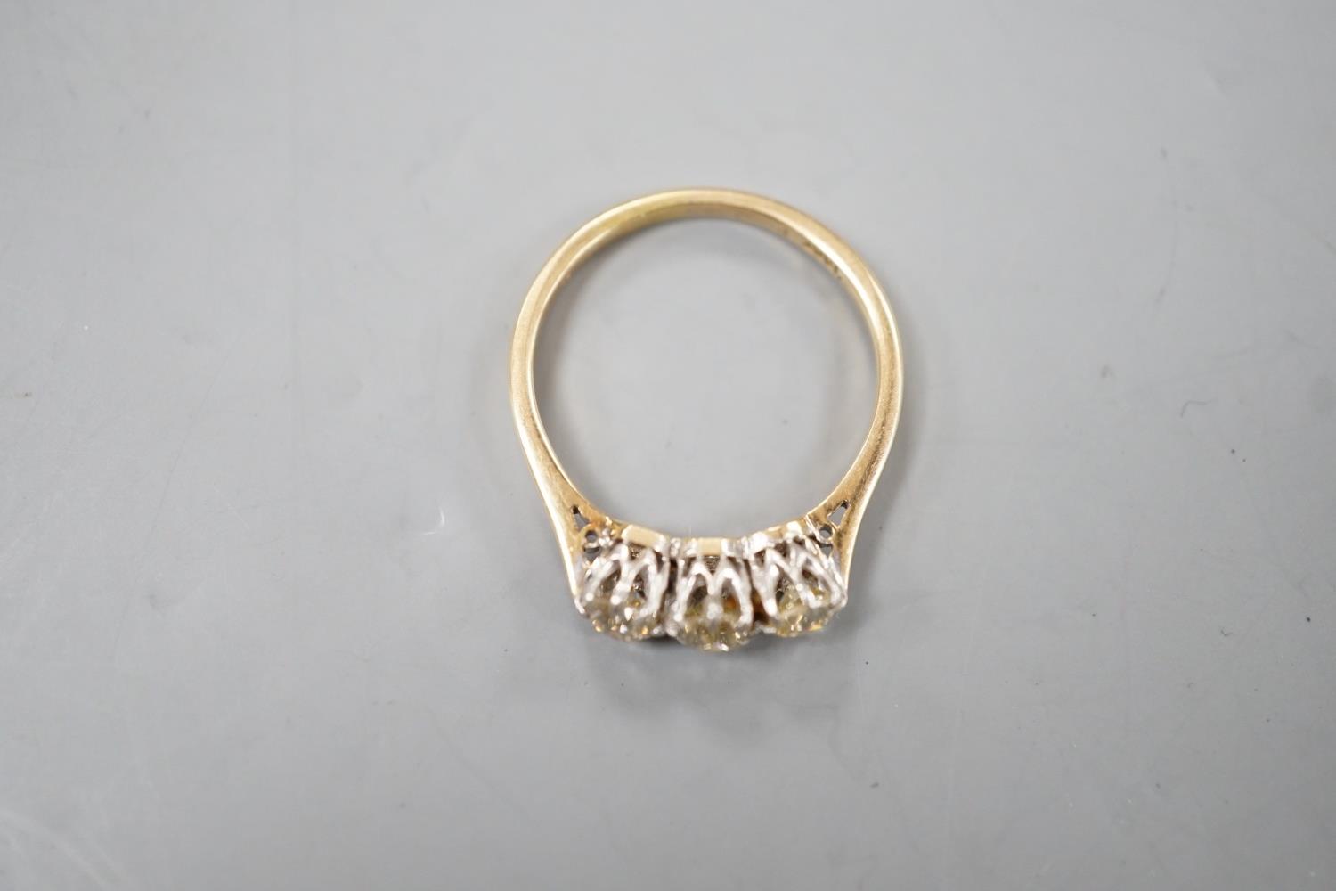 An 18ct and three stone diamond set ring, size P, gross weight 2.8 grams. - Image 3 of 5