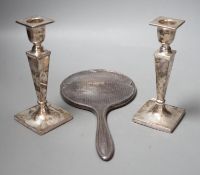 A pair of George V silver candlesticks, with tapering stems, Walker & Hall, Sheffield, 1915, 16.4cm,