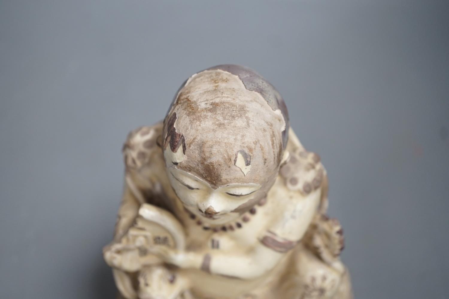 A Chinese Cizhou seated figure of Liu Hai, possibly Ming dynasty, 21cms high, glaze flaking - Image 5 of 10