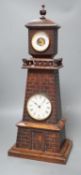 A late Victorian carved oak 'lighthouse' combined mantel timepiece and barometer, signed Frank