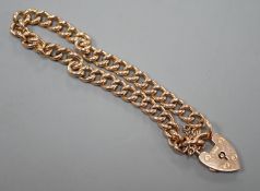 An Edwardian 9ct gold curb link bracelet wit heart shaped padlock clasp, approx. 18cm, 11.4 grams.