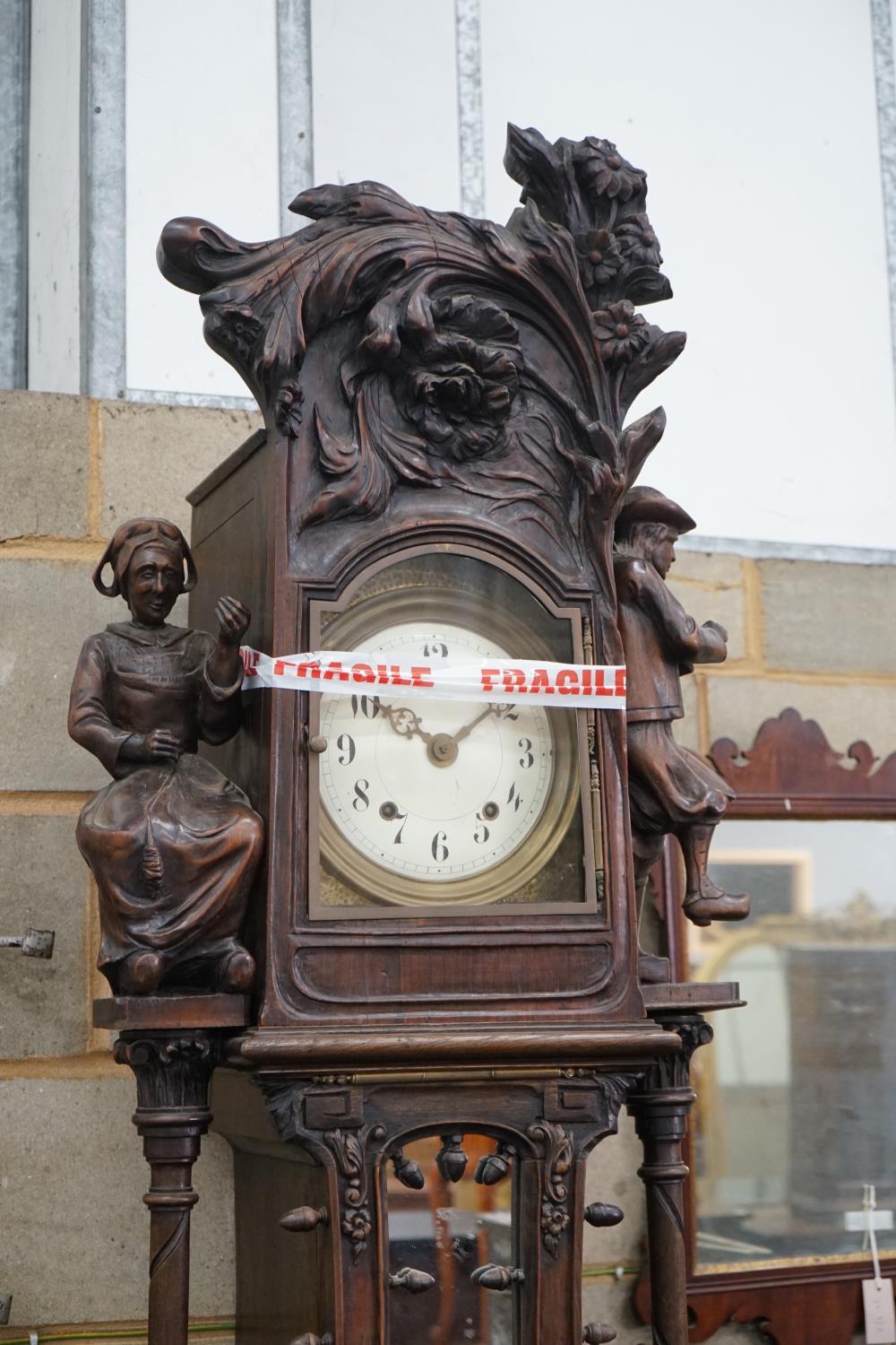An early 20th century Flemish carved oak and walnut longcase clock, height 240cms. - Image 5 of 5