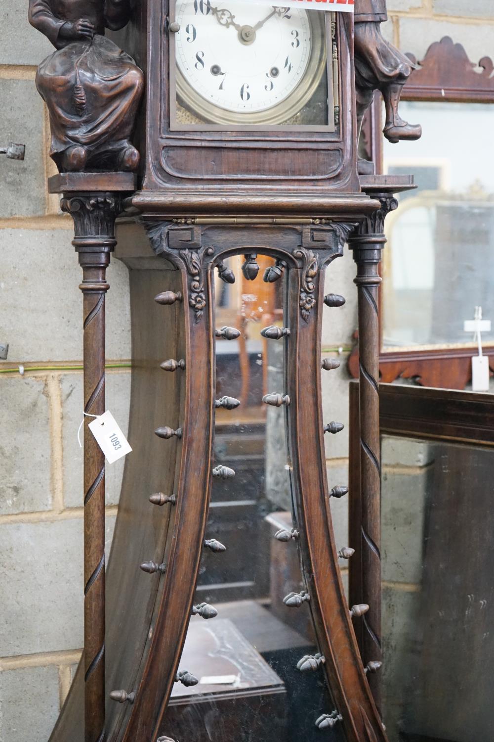 An early 20th century Flemish carved oak and walnut longcase clock, height 240cms. - Image 2 of 5