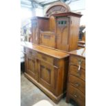 An early 20th century German Art Nouveau walnut buffet, length 141cm, depth 64cm, height 197cm