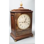 A Regency brass inlaid mahogany bracket clock, with pineapple finial, bears interior paper label