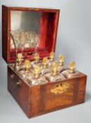 A 19th century Dutch inlaid mahogany decanter box containing nine gilt glass decanters and two