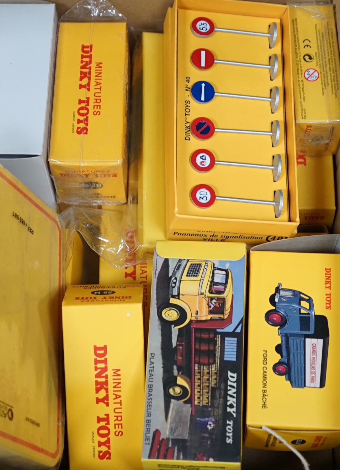 A large quantity of boxed dinky lorries, vans, road sins, petrol pump, etc