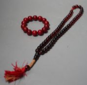 Two simulated Cherry Amber beads