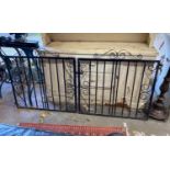 A pair of painted wrought iron garden gates, each gate width 101cm, height 99cm together with a