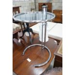 In the style of Eileen Gray - An E 1027 style circular chrome and smoked glass telescopic occasional