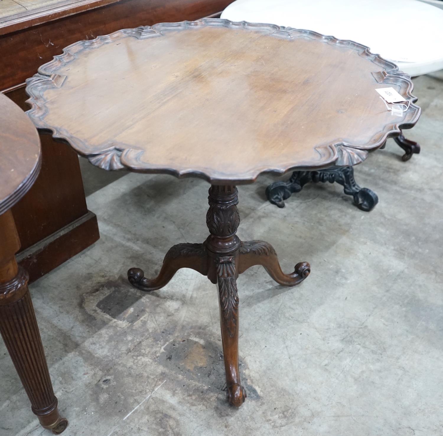 A George III style circular mahogany tilt top tripod tea table, diameter 81cm, height 74cm