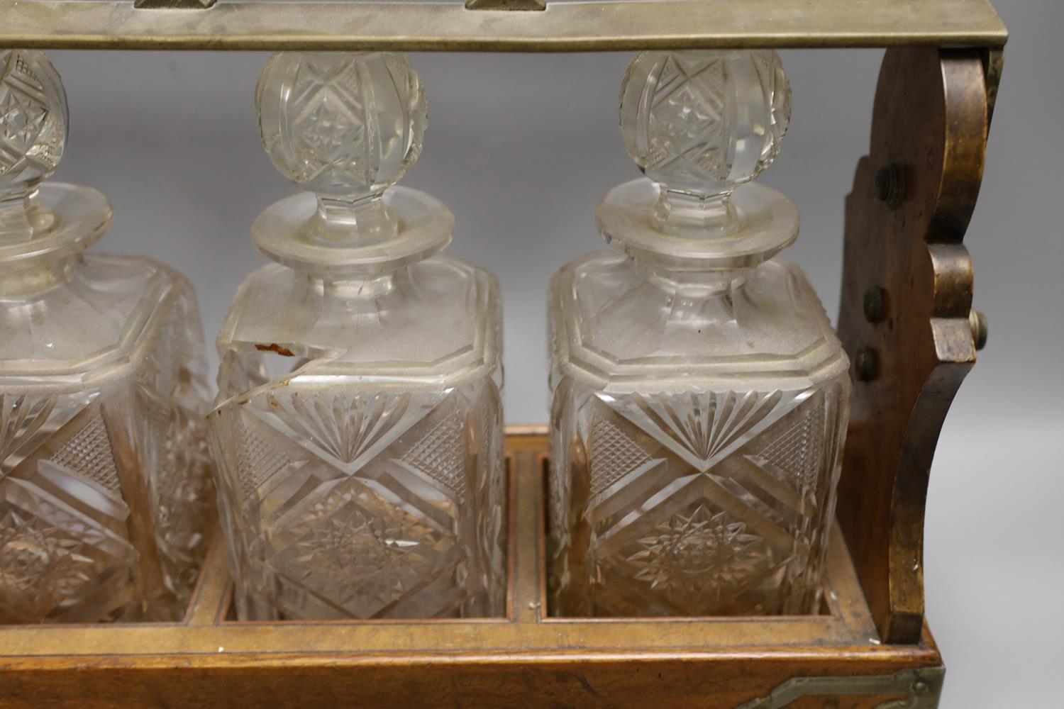 A Victorian Betjemann’s patent oak cased three bottle tantalus (a.f.), 42cms wide at base - Image 3 of 3