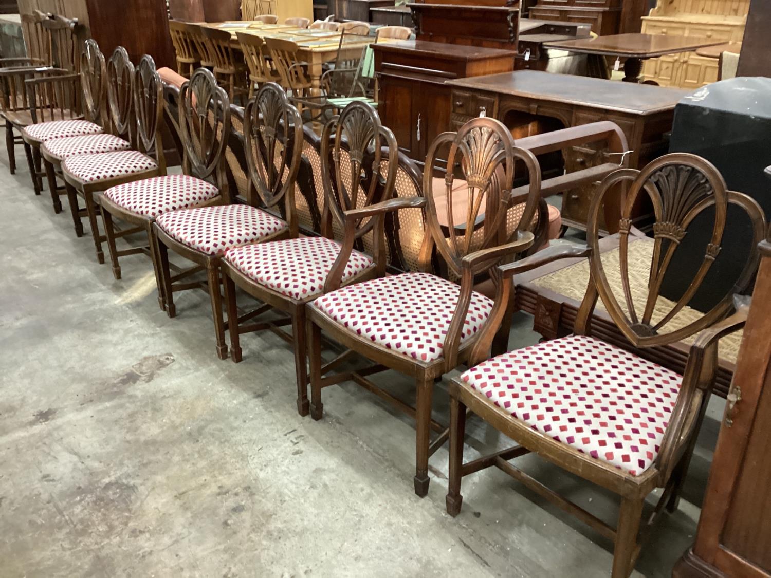 A set of eight Hepplewhite style mahogany dining chairs, two with arms