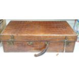 An early 20th century crocodile skin suitcase - 60cm wide