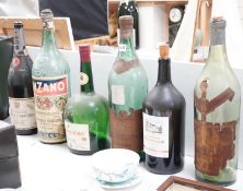 A collection of oversize and advertising bottles for Cinzano, Courvoisier, Moet Chandon, Rouyer