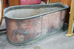 A 19th century copper bath of tapering form, length 162cm, depth 68cm, height 63cm