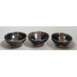 Three Chinese Jian type hare's fur bowls, 9cms diameter