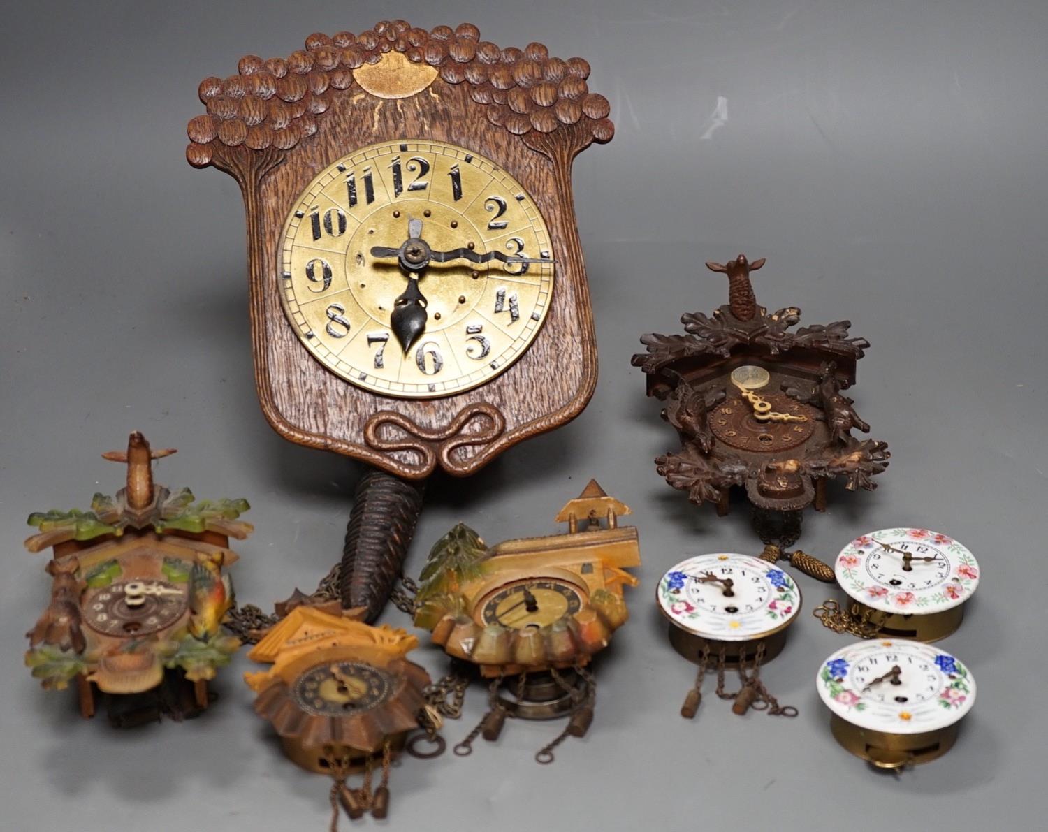 An early 20th century German Jugendstil oak wall timepiece, four miniature Black Forest timepieces - Image 3 of 8