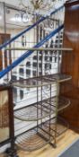 A 19th century French wrought iron and brass bakers rack, width 115cm, depth 46cm, height 215cm