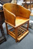 A pair of Chinese elm armchairs with roller footrests, width 57cm, depth 53cm, height 89cm