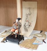 A Japanese seated Samurai figure on stand, two appliquéd fabric figures and a Chinese print, tallest