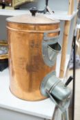 A copper coffee bean dispenser. 60cm high