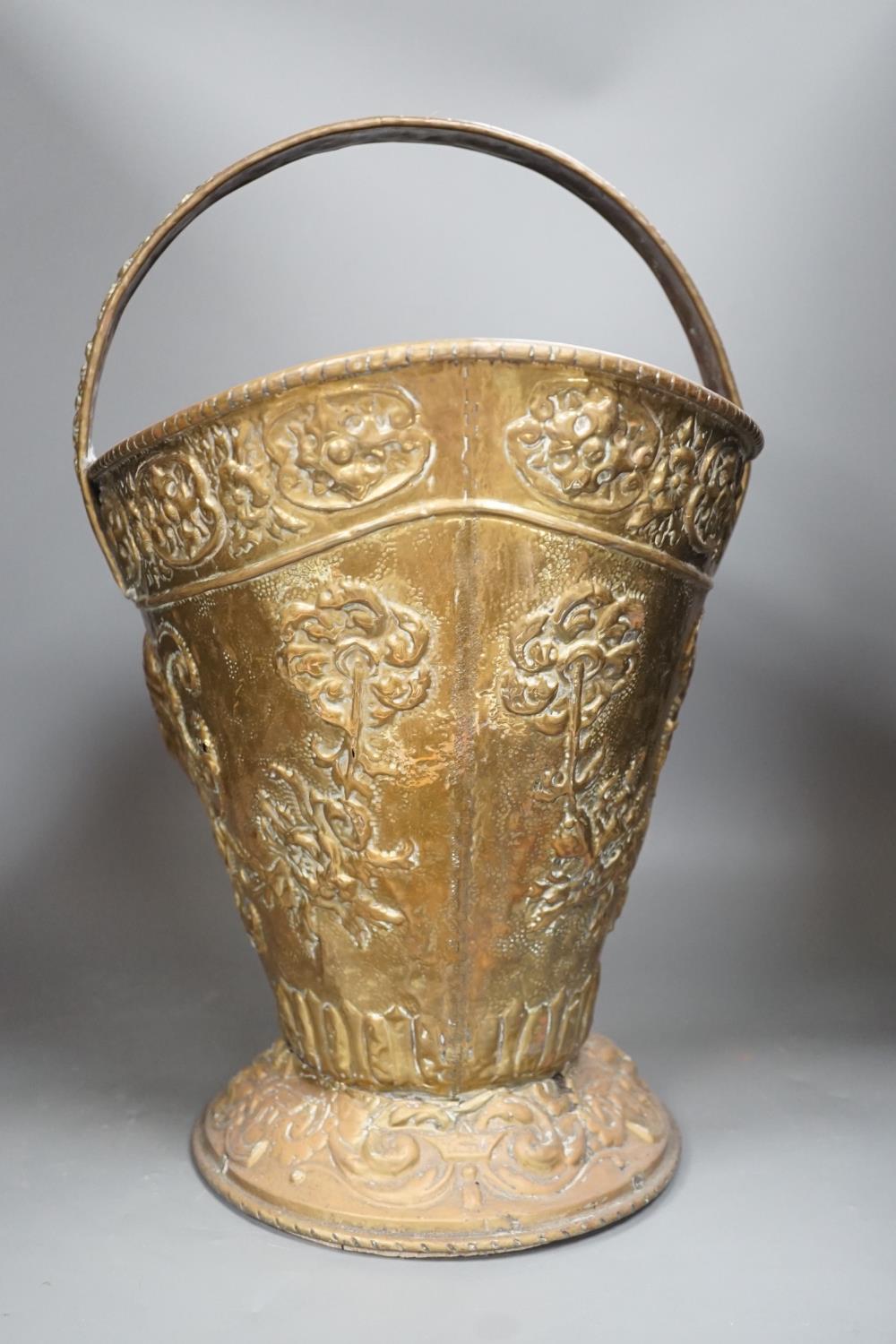 An embossed brass helmet coal bucket, 48cms high - Image 3 of 6