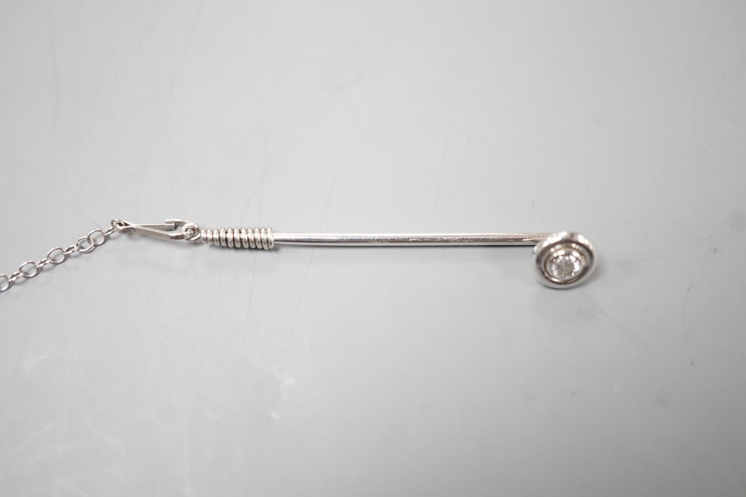 A white metal and collet set solitaire diamond tie pin, 43mm, with safety chain, gross weight 2.1 - Image 2 of 3