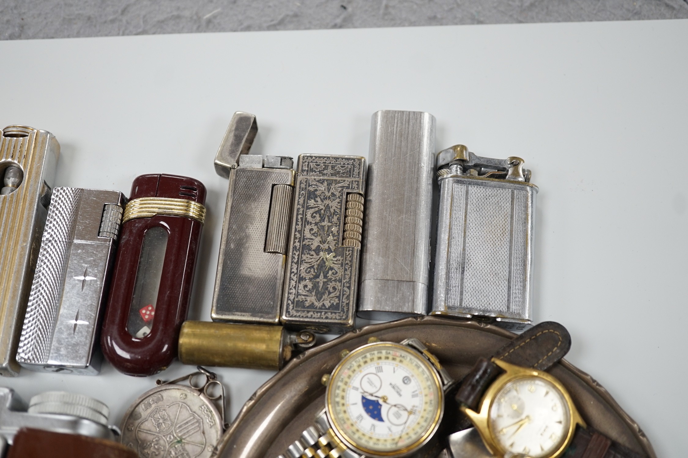 A collection of mixed wristwatches and cigarette lighters and a camera - Image 3 of 6