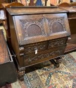 An 18th century style carved oak bureau, width 87cm, depth 47cm, height 106cm