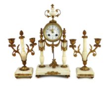 A Louis XVI style ormolu mounted white marble eight day mantel clock and a matching pair of twin