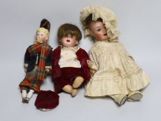 A German bent limb doll, face cracked H12in. German bent limb character baby doll H9in. bisque