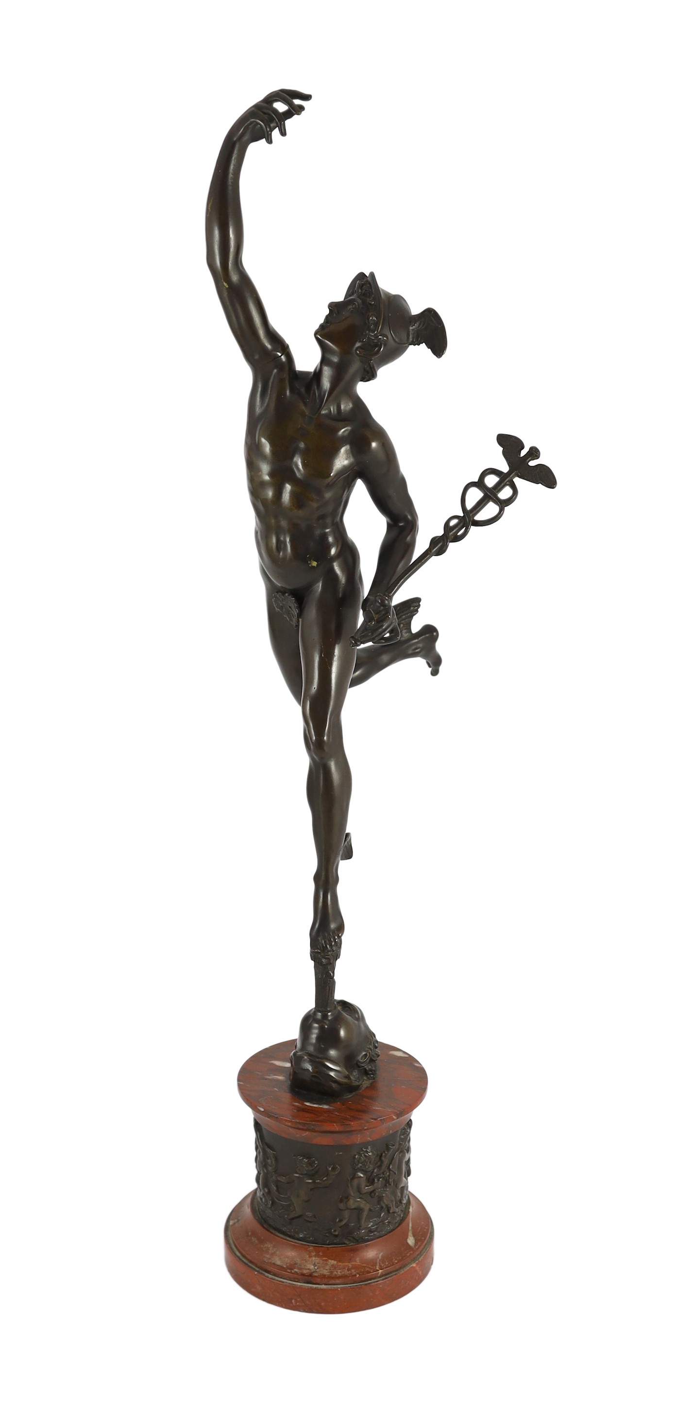 After Giambologna. A tall Grand Tour bronze figure of Mercury, on red marble socle with bronze
