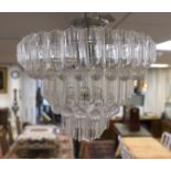 A perspex three tier chandelier