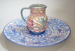 A Burleigh ware Charlotte Rhead lustre jug and a Crown Ducal dish, diameter 32cm