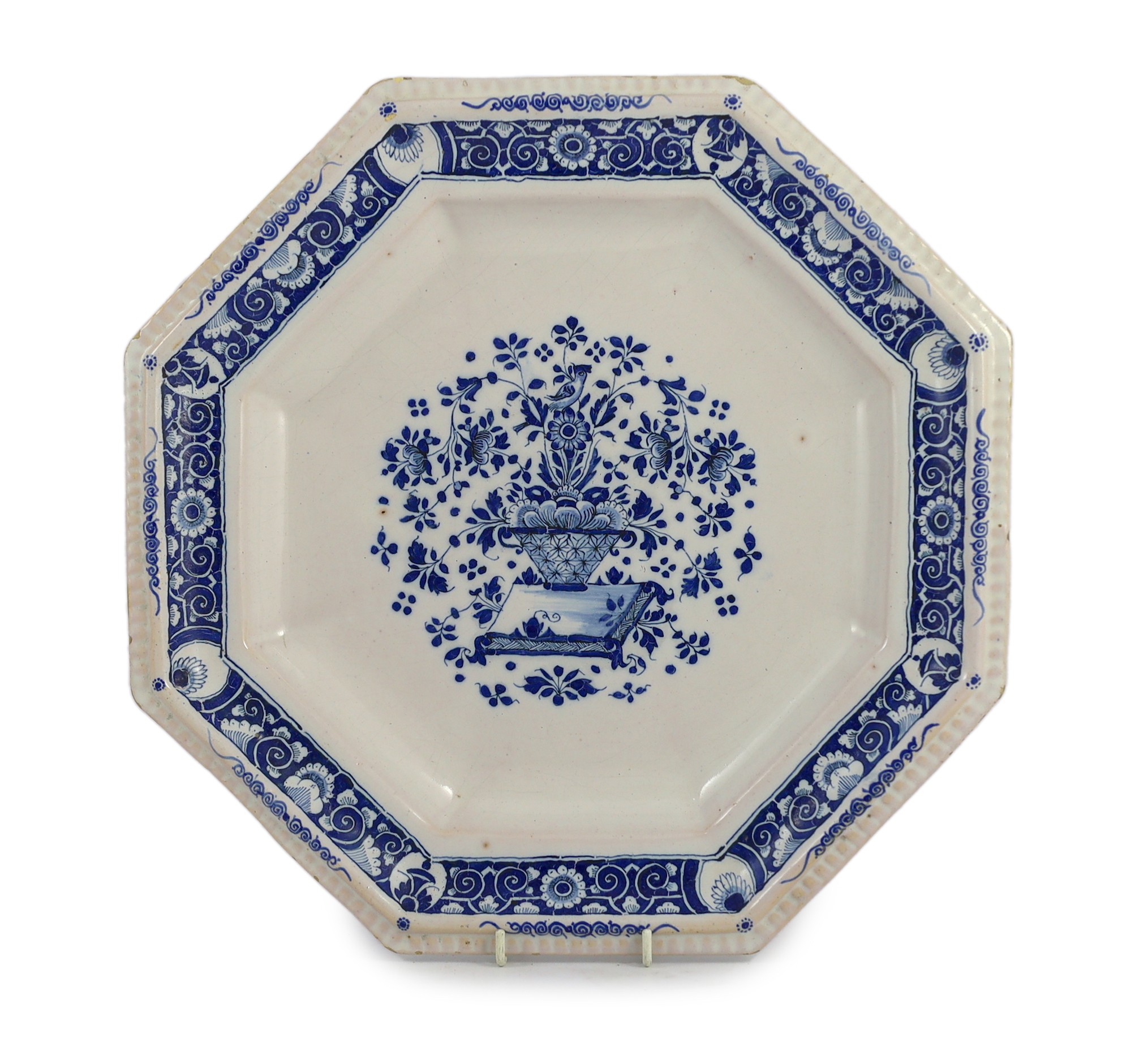 A large Strasbourg faience octagonal dish, c.1720-40, painted in blue with a basket of flowers,