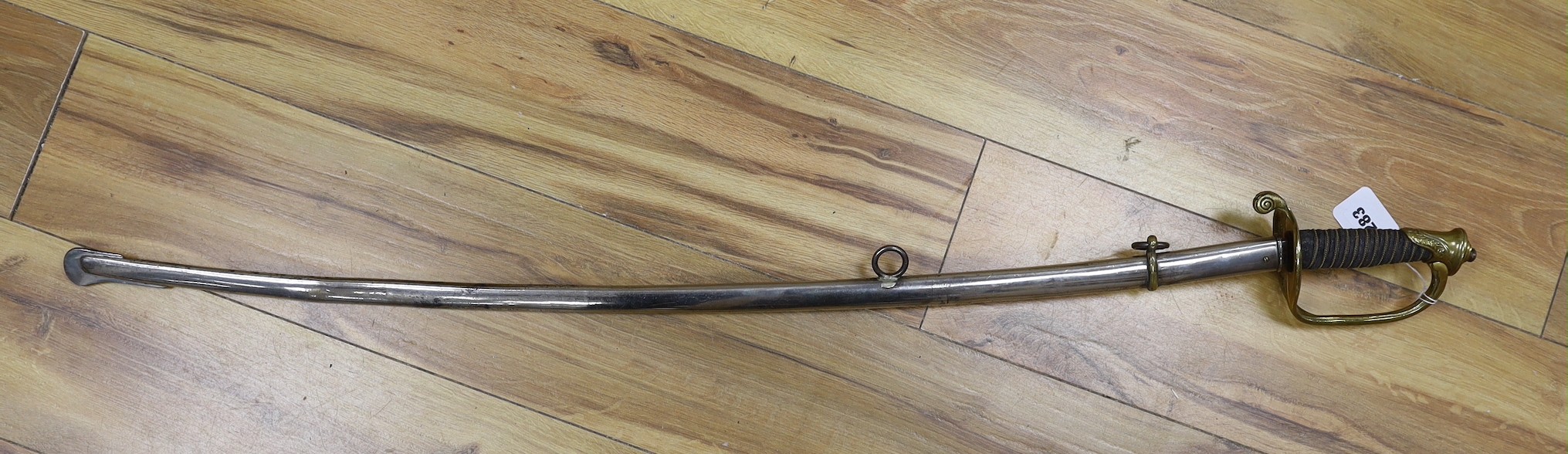 A United States Marines dress sword made by Wilkinson, the blade etched ‘S/SGT. JAMES P.S.