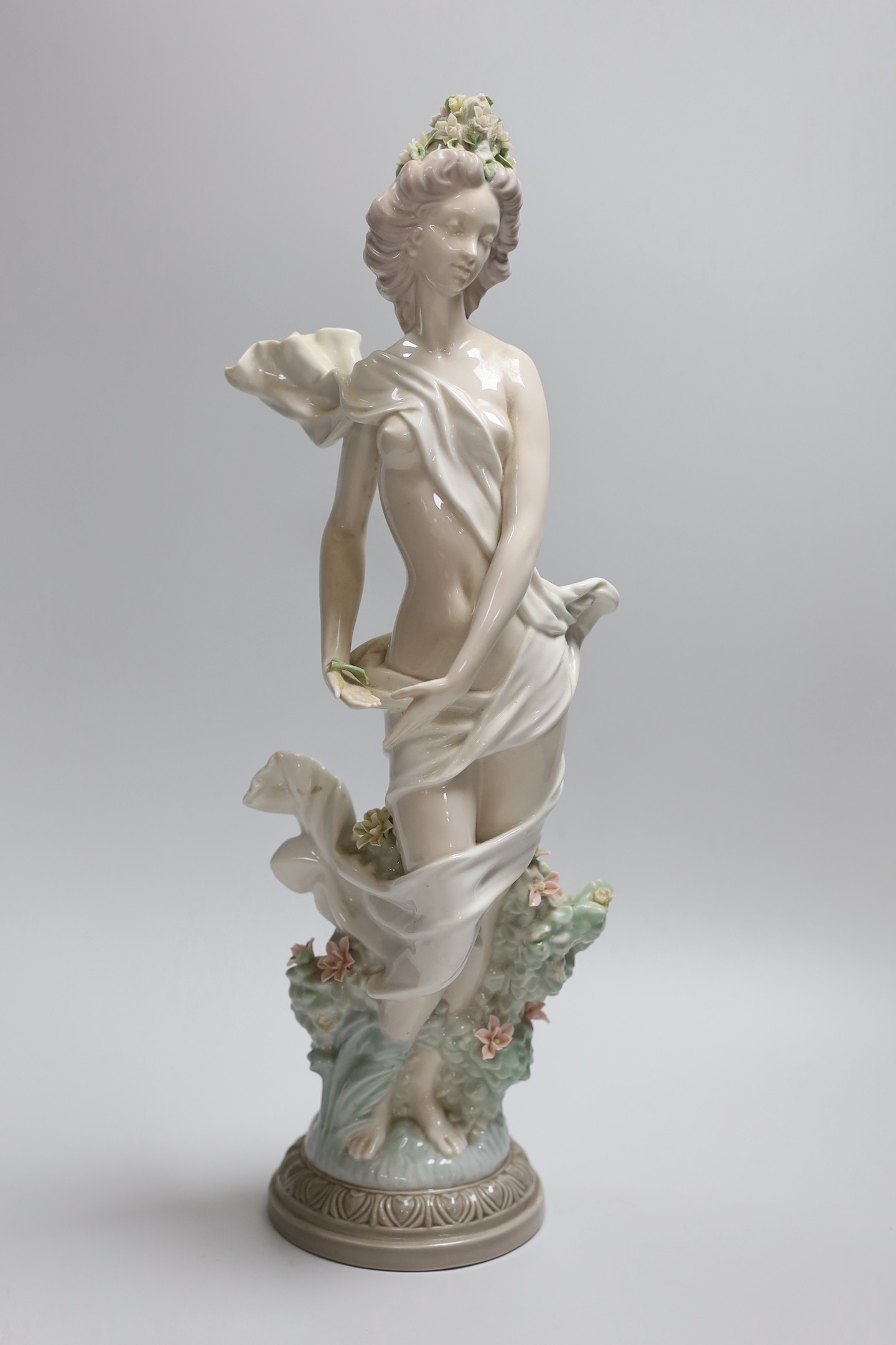 A Lladro figure of a maiden, decorators signature on base, No 40141 cms.