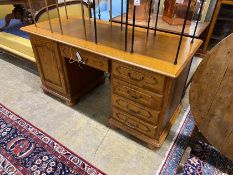 A reproduction French style oak kneehole desk, length 166cm, depth 69cm, height 79cm