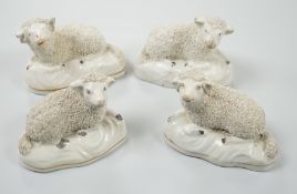 Four small Staffordshire models of recumbent sheep, c.1830-50. 8.5cm longProvenance: Dennis G.Rice