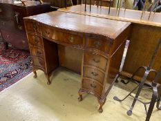 A George III style mahogany leather topped serpentine kneehole desk, length 98cm, depth 56cm, height