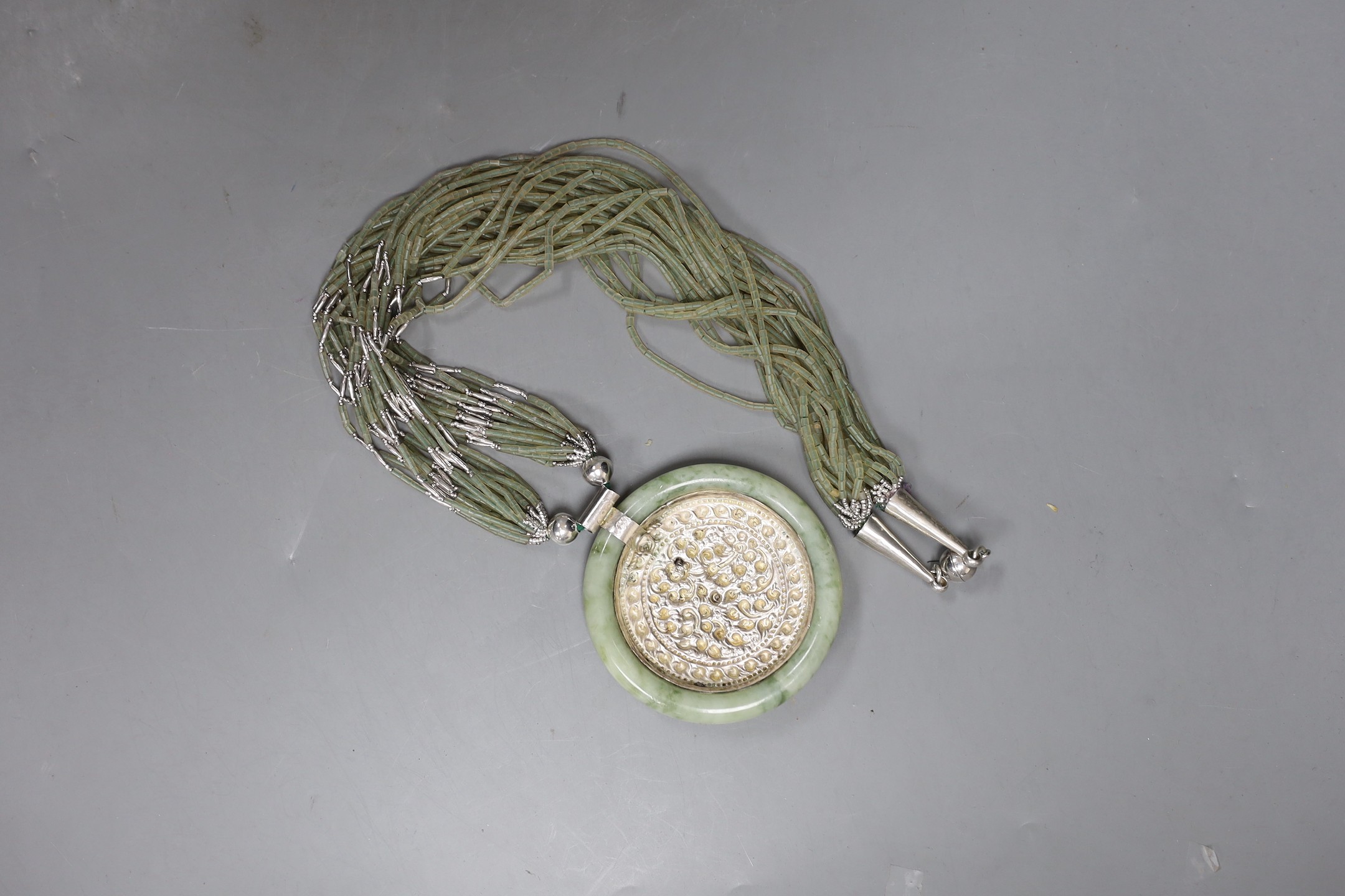 A Kai-Yin-Lo of Hong Kong jadeite and white metal mounted necklace, 81cm. - Image 2 of 2