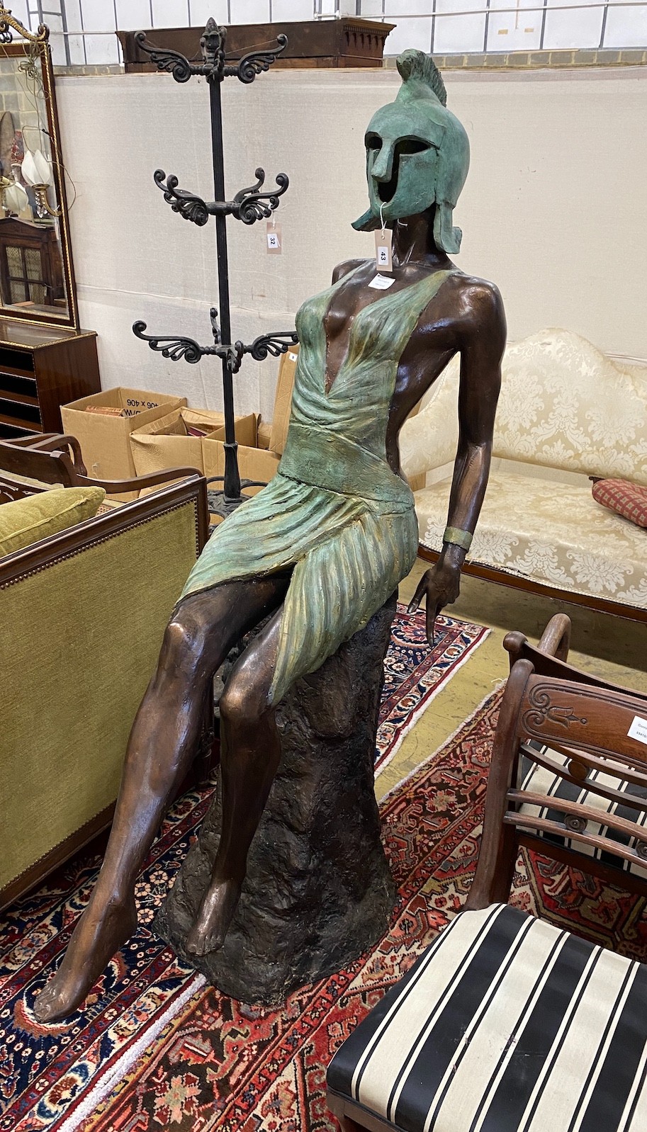 A bronzed resin sculpture of a female Greek warrior, height 174cm