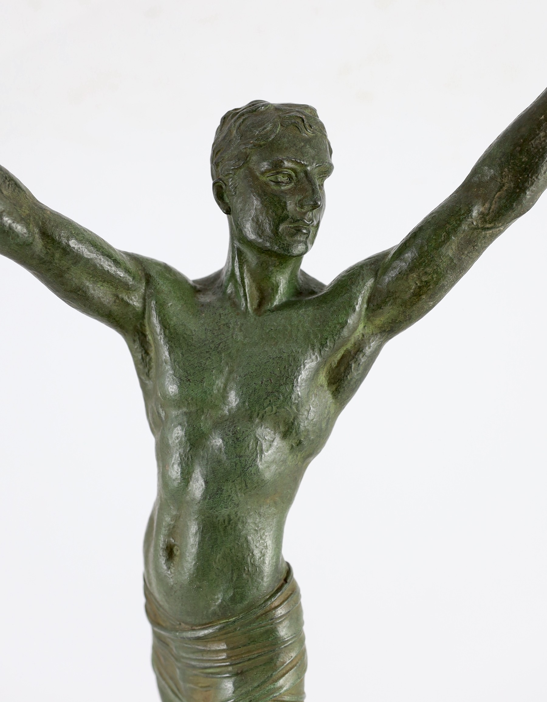 J. Darcourt. NB. An Art Deco patinated spelter figure of a victorious athlete, standing with arms - Image 2 of 5