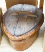 A 19th Century French terracotta ham-smoking pot with original wooden lid.