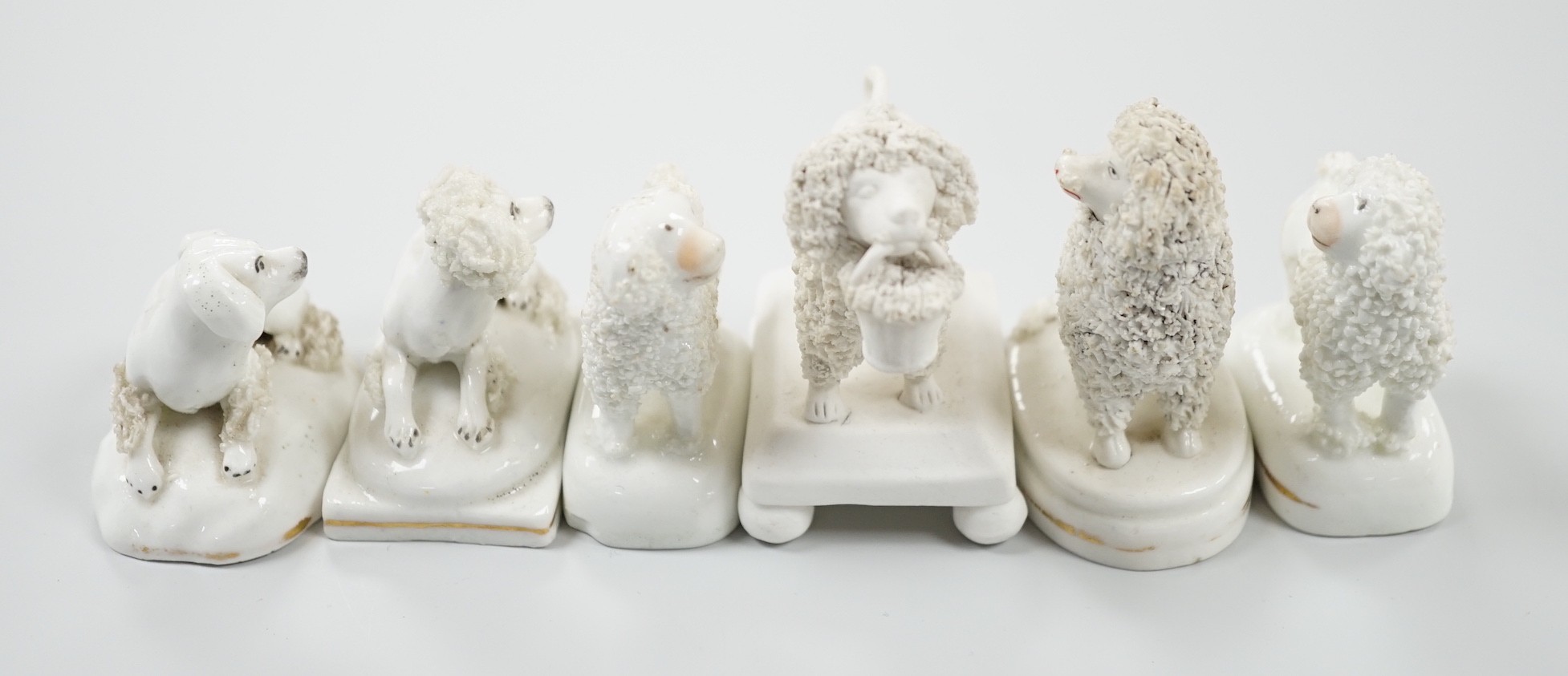 Five small Staffordshire models of poodles, together with a small poodle lying recumbent on an - Image 5 of 7