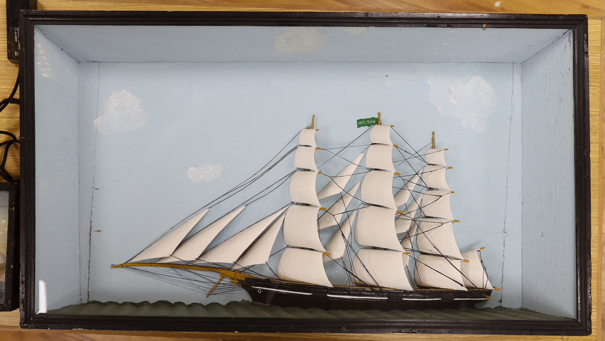 A painted half ship diorama, Perspex glazed frame (Nelson), 52x92cm total