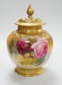 A Royal Worcester pink rose painted pot pourri vase and cover. 14cm tall