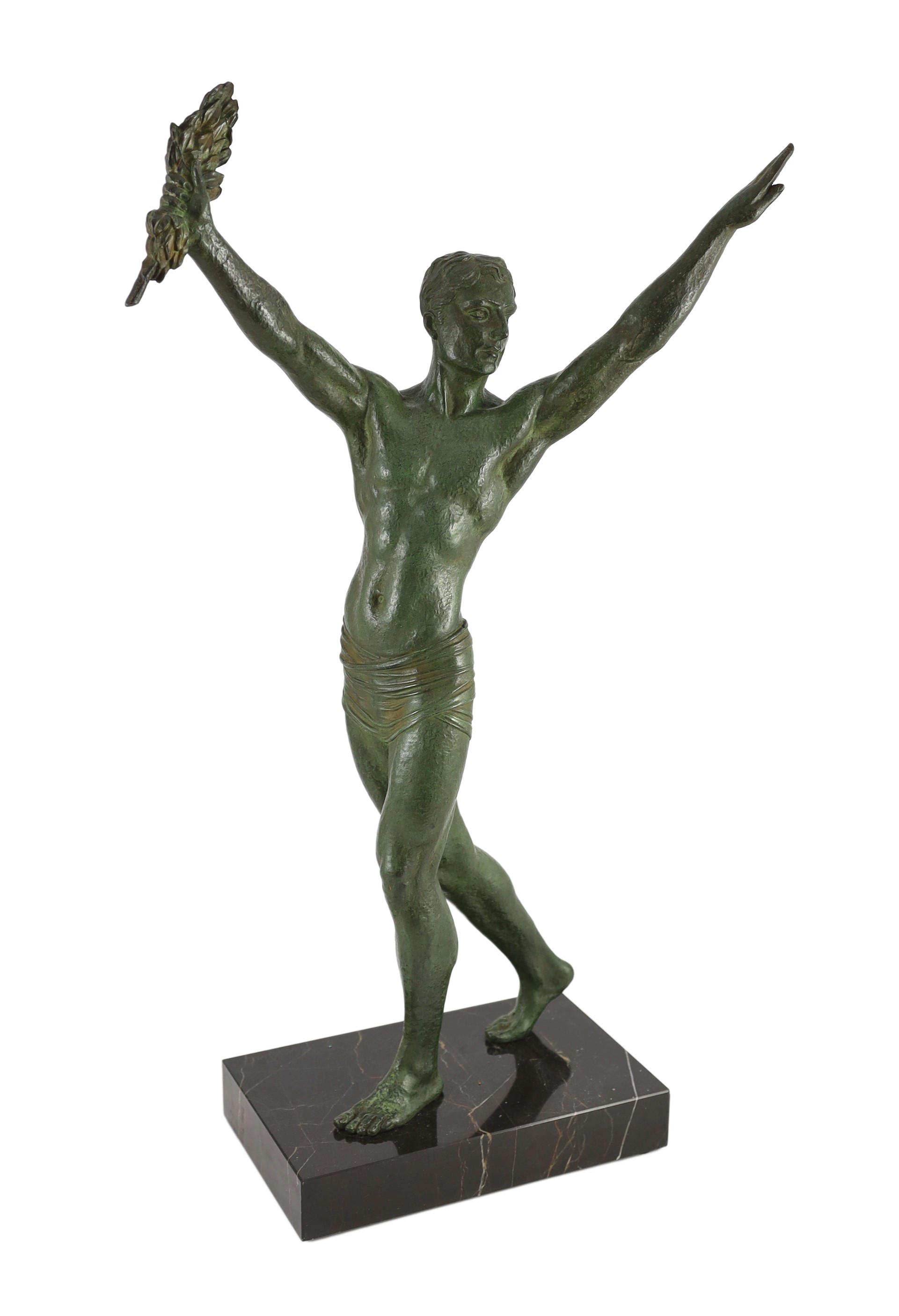 J. Darcourt. NB. An Art Deco patinated spelter figure of a victorious athlete, standing with arms