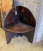 A provincial carved oak corner chair, width 62cm, depth 44cm, height 84cm